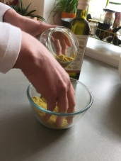 Filling the jar halfway full of chamomile